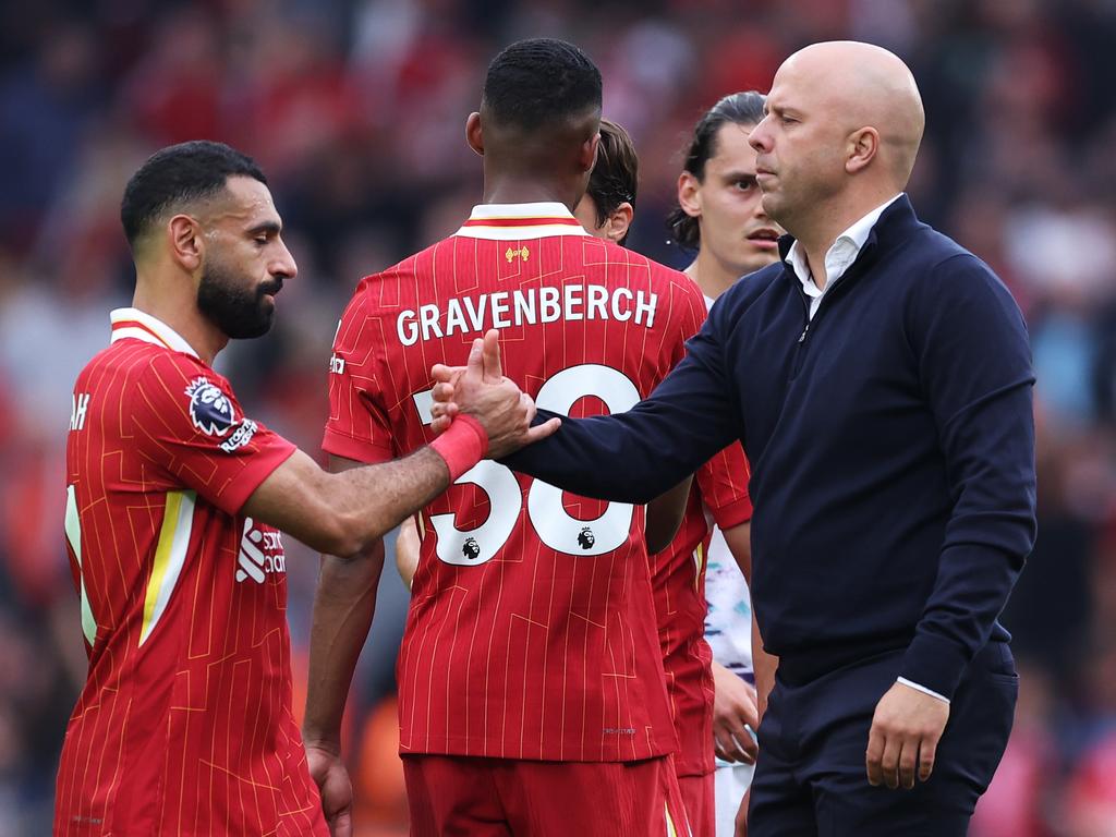 LIVERPOOL, ENGLAND - SEPTEMBER 21: Mohamed Salah of Liverpool and Arne Slot, Manager of Liverpool, shale hands after the Premier League match between Liverpool FC and AFC Bournemouth at Anfield on September 21, 2024 in Liverpool, England. (Photo by Alex Livesey/Getty Images)