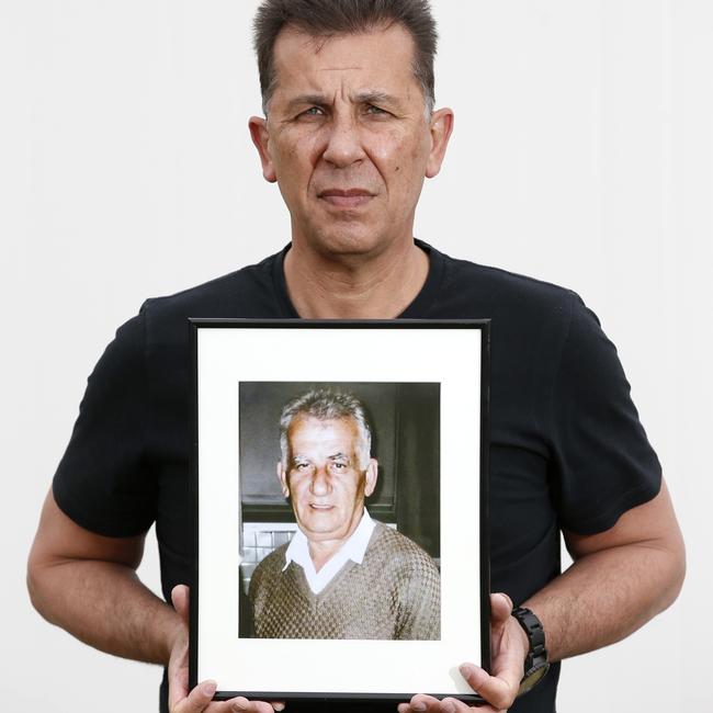 Tony Ioanou holding picture of his dad Zisis Ioanou. Picture: David Caird