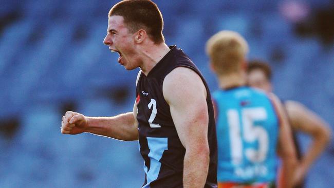 Jack Higgins celebrates a goal for Vic Metro.