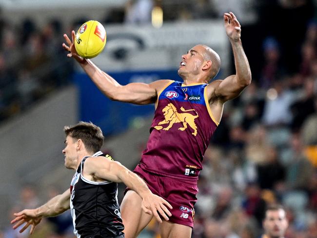 Starcevich flies for a mark over Mason Wood. Picture: Bradley Kanaris/Getty Images