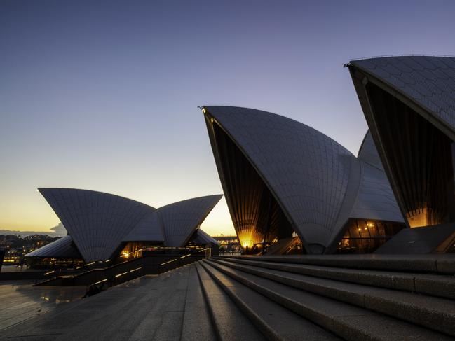 ESCAPE: Sydney Australia - May 21, 2011: Evening descends upon Sydney in New South Wales, Australia. The western sky is still quite bright, though the the lights are coming on in and around the iconic Opera House. Picture: Istock