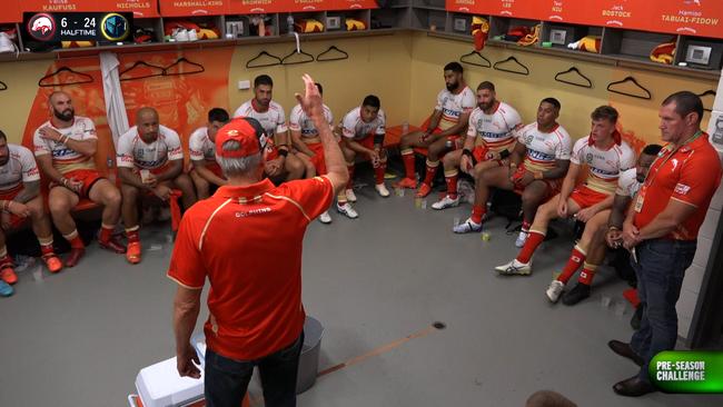 Wayne Bennett addresses his players at half time.