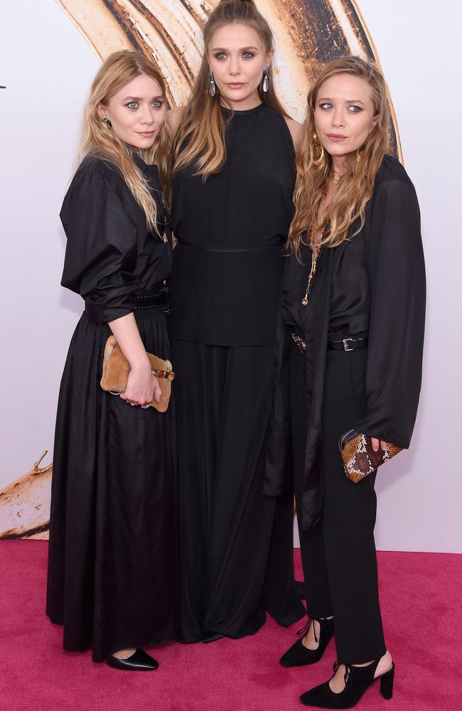 The sisters matched with all-black ensembles.