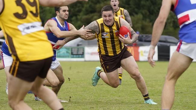 Anthony Brolic with the ball for Rowville. Picture: Valeriu Campan