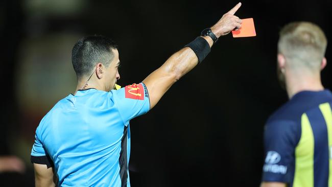Referee Steven Lucas shows Matt Simon a red card during an A-League game last month. Picture: Getty