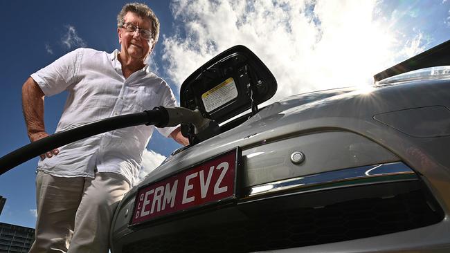 Energy rich-lister Trevor St Baker recharges his electric vehicle in Brisbane.