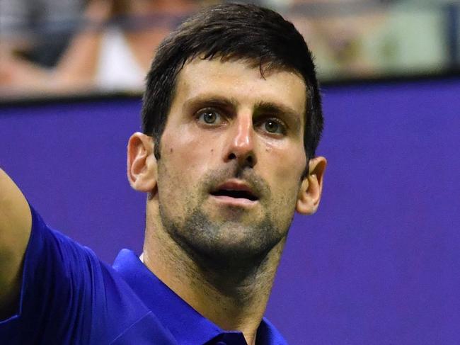 Serbia's Novak Djokovic celebrates after winning a point against USA's Jenson Brooksby during their 2021 US Open Tennis tournament men's singles fourth round match at the USTA Billie Jean King National Tennis Center in New York, on September 6, 2021. (Photo by Ed JONES / AFP)