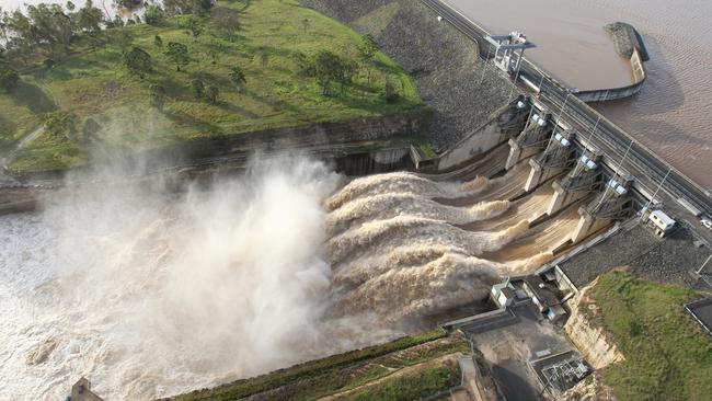 Water pours over the spillway at Wivenhoe Dam, west of Brisbane, in 2011.