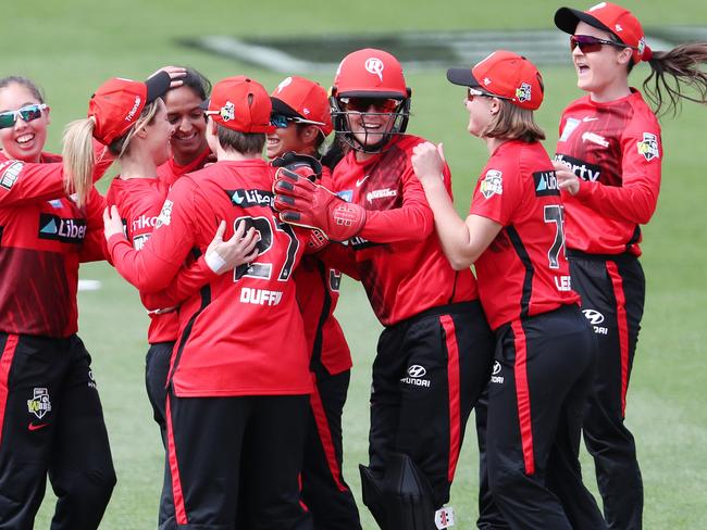 LAUNCESTON, AUSTRALIA - OCTOBER 24:  Harmanpreet Kaur of the Melbourne Renegades surrounded by team mates after she claimed the wicket of  Alyssa Healy of the Sydney Sixers caught and bowled for 5 runs  during the Women's Big Bash League match between the Sydney Sixers and the Melbourne Renegades at University of Tasmania Stadium, on October 24, 2021, in Launceston, Australia. (Photo by Sarah Reed/Getty Images)