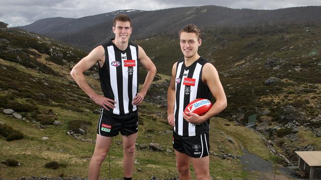 Mason Cox and Darcy Moore model Collingwood’s jumper with new emblem and apparel sponsors logo in Falls Creek. Picture: Michael Klein