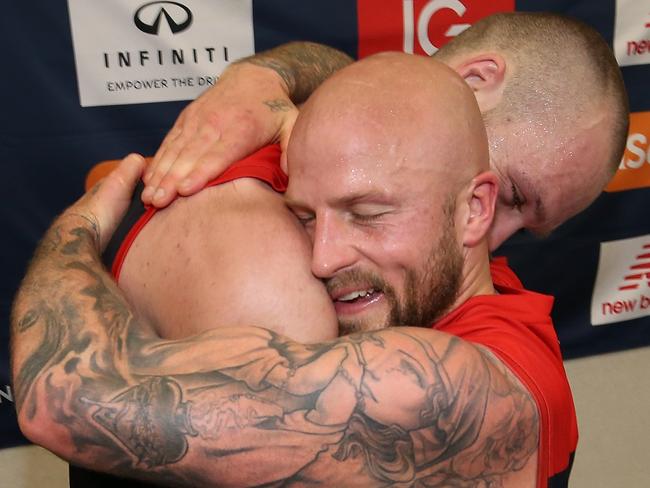 Max Gawn and Nathan Jones share a hug after the Dees’ win. Pic: Getty Images