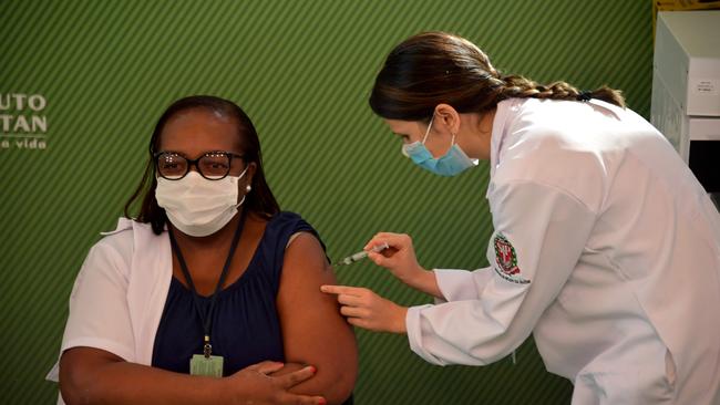 Nurse Monica Calazansis is inoculated with Sinovac at Clinicas hospital in Sao Paulo, Brazil, on Monday. Picture: AFP