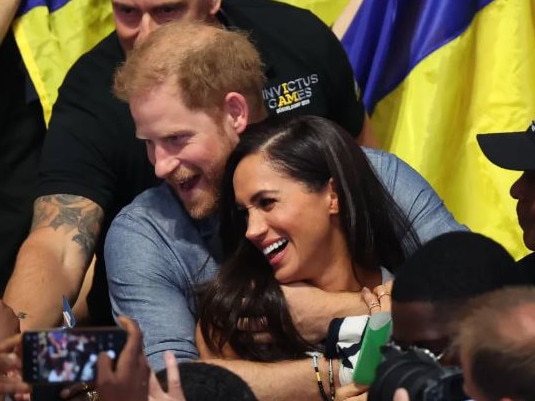 Prince Harry and Meghan Markle put on a loved up display at the Invictus Games. Picture: Supplied