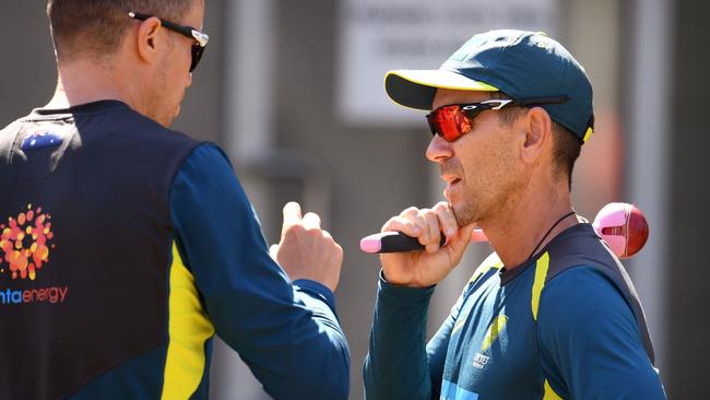 Australian bowler Peter Siddle, left, with coach Justin Langer