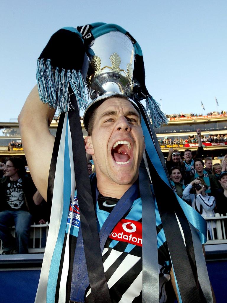 Port captain Warren Tredrea with the premiership cup in 2004.