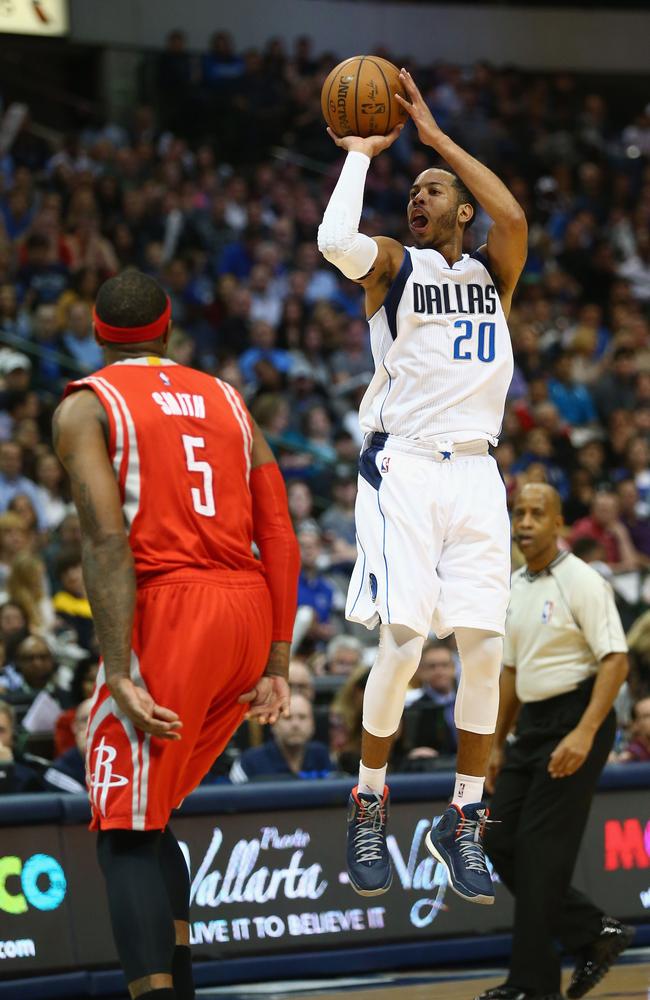 Devin Harris of the Dallas Mavericks takes a shot against the Houston Rockets.