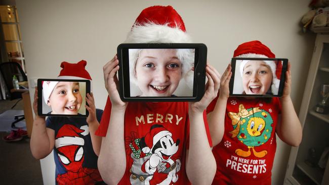 Siblings Tyler, 6, Tahlia, 13 and Keira, 11, are looking forward to virtual carols. Picture: David Caird