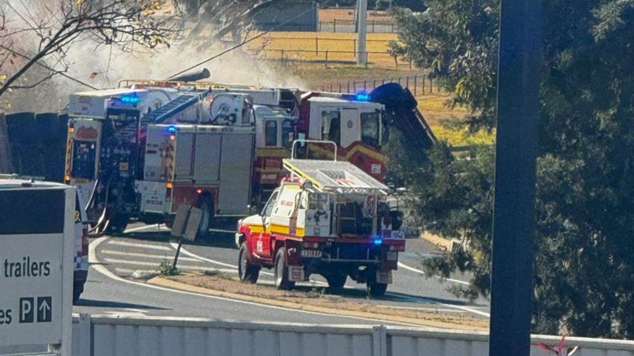 A cattle truck has rolled and caught fire on Albion Street in Warwick, leaving livestock needing to be herded. Photos courtesy of Ali Yusuf.