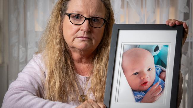 Julie Hughes with her late grandson Riley, who died aged four weeks from whooping cough. Photo: Naomi Jellicoe