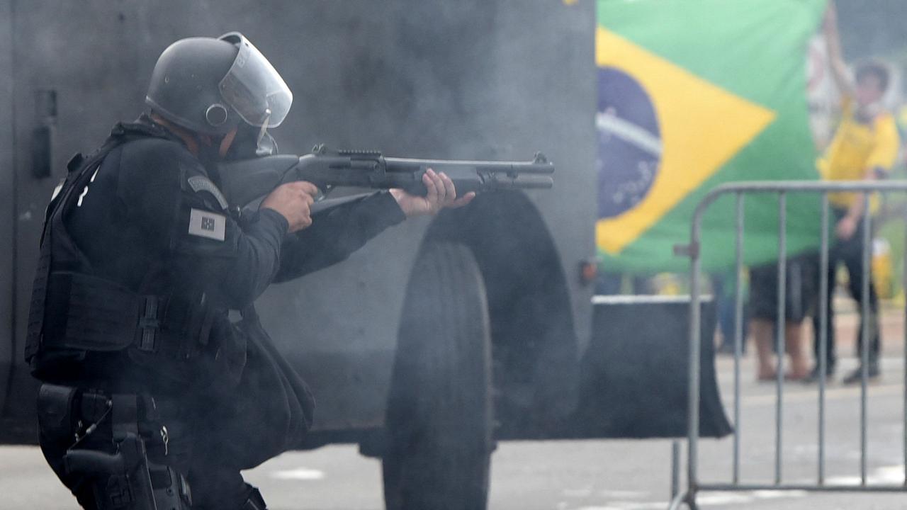 Security forces confront supporters of Brazilian former President Jair Bolsonaro invading Planalto Presidential Palace in Brasilia on January 8, 2023. Picture: AFP