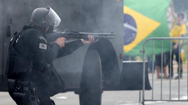 Security forces confront supporters of Brazilian former President Jair Bolsonaro invading Planalto Presidential Palace in Brasilia on January 8, 2023. Picture: AFP