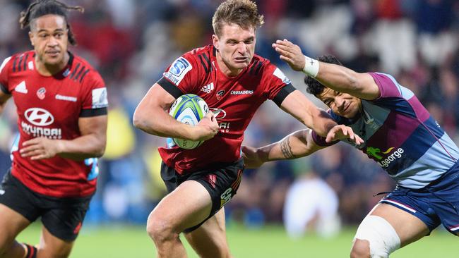 The Crusaders’ George Bridge makes a break against the Reds in Christchurch. Picture: Getty Images