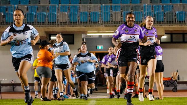 The Litchfield Bears run on in their purple women in league jerseys against the Northern Sharks. Picture: Karen Fowler