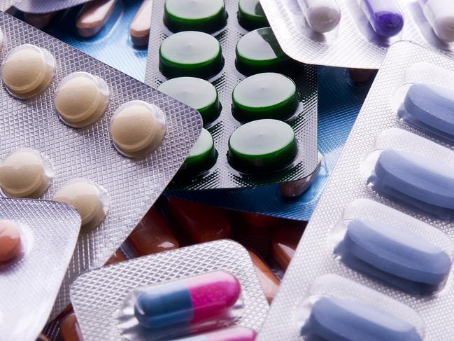 Close up of packs of pills and capsules.