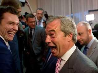 Nigel Farage, center, the leader of the UK Independence Party reacts in celebration at a "Leave.EU" organization party for the British European Union membership referendum in London, Friday, June 24, 2016. Source AAP