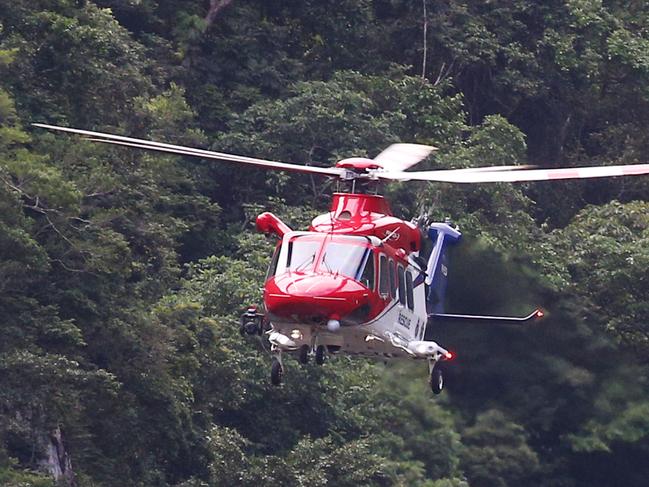 Emergency services personnel attend an incident at Barron Gorge where a teenager reportedly fell 30 metres down a cliff. The Rescue 510 helicopter recovered the teen and flew him to hospital.  PICTURE: BRENDAN RADKE