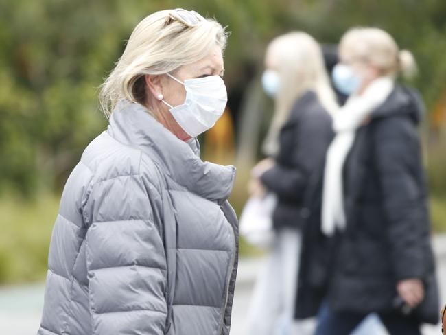 Masks very obvious in Geelong CBD on Sunday. Among them were a couple of buskers. Picture: Alan Barber