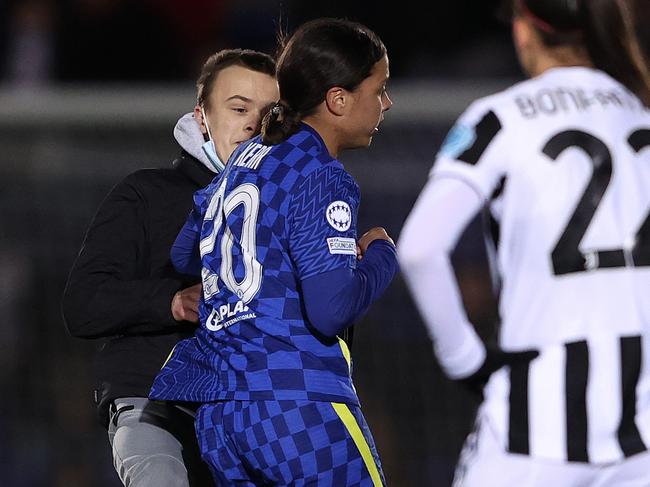 A pitch invader collides with Sam Kerr of Chelsea during the UEFA Women's Champions League group A match between Chelsea FC and Juventus. (Photo by Warren Little/Getty Images)