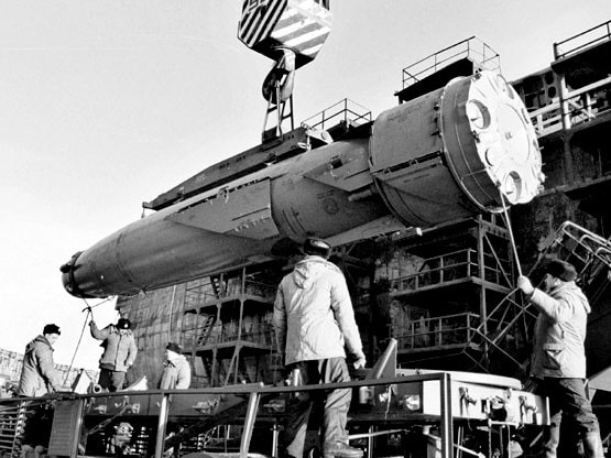 A missile is put on a trailer after being extracted from the wreck of nuclear submarine Kursk while in dry dock at the northern Russian port of Roslyakovo in 2001.