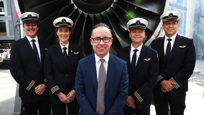 Qantas CEO Alan Joyce poses with Qantas crew. Picture: John Feder