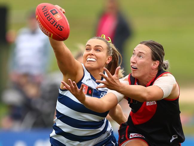 WARRNAMBOOL, AUSTRALIA - OCTOBER 08: Claudia Gunjaca of the Cats (L) and Sophie Alexander of the Bombers compete for the ball during the round six AFLW match between Essendon Bombers and Geelong Cats at Reid Oval on October 08, 2023 in Warrnambool, Australia. (Photo by Graham Denholm/AFL Photos via Getty Images)