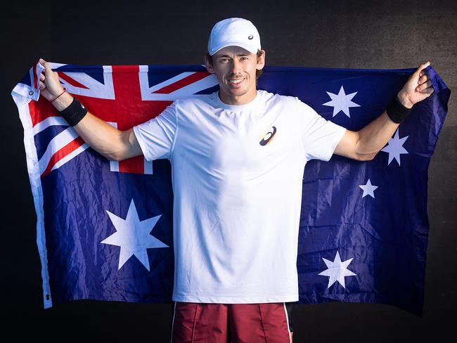 ***CONTACT HERALD SUN PIC DESK BEFORE USING*** MELBOURNE, JANUARY 11, 2024: Alex de Minaur poses with the Australian flag ahead of the Australian Open. Picture: Mark Stewart