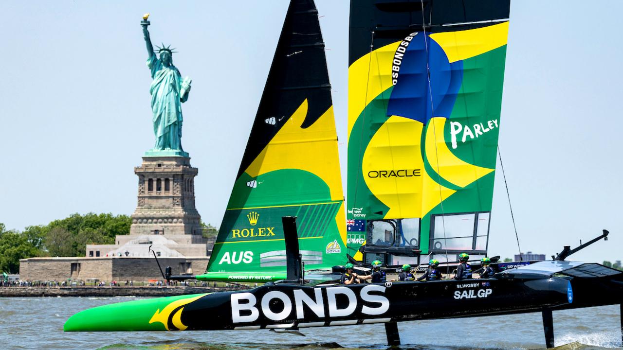 Australia's BONDS Flying Roos sailing in front of the Statue of the Liberty. Photo: SailGP/Supplied.
