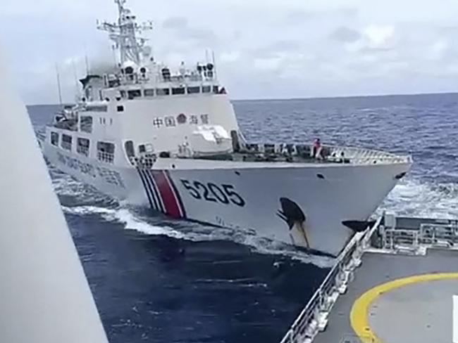 TOPSHOT - This frame grab from handout video footage taken and released on August 31, 2024 by the Philippine Coast Guard (PCG) shows a Chinese coast Guard ship (L) colliding with Philippine Coast Guard ship BRP Teresa Magbanua near the Sabina Shoal in disputed waters of the South China Sea. China and the Philippines accused each other on August 31 of deliberately ramming their coast guard ships near a flashpoint shoal in the South China Sea, the latest in a spate of similar incidents in recent weeks. (Photo by Handout / Philippine Coast Guard (PCG) / AFP) / RESTRICTED TO EDITORIAL USE - MANDATORY CREDIT "AFP PHOTO / PHILIPPINE COAST GUARD (PCG)" - NO MARKETING NO ADVERTISING CAMPAIGNS - DISTRIBUTED AS A SERVICE TO CLIENTS