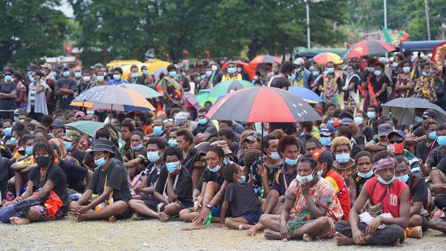 Mourners attend the funeral of former PNG prime minister Sir Michael Thomas Somare, sparking fears of a health crisis. Picture: Andy Hau