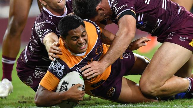 Anthony Milford, The Incredible Shrinking Man, squeezes through a tiny hole against the Sea Eagles. Picture: AAP/Darren England