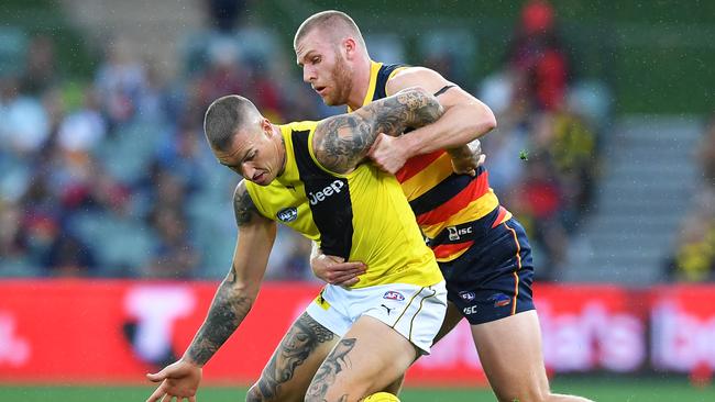 Andrew McPherson tackles Dustin Martin this year. Picture: Mark Brake (Getty).