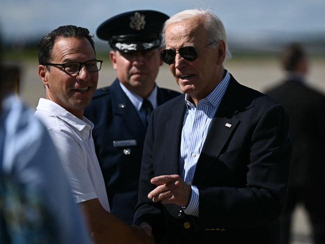 US President Joe Biden (R) is greeted by Pennsylvania Governor Josh Shapiro (L) upon arrival at Pittsburgh International Airport in Pittsburgh, Pennsylvania. Picture: AFP