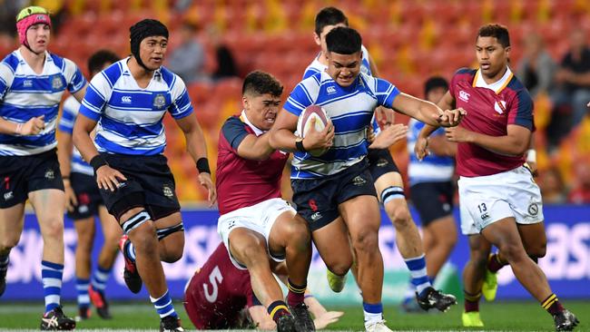 Titi Nofoagatotoa (centre) of Nudgee College in action during the St Joseph's Nudgee College and Brisbane State High School GPS Rugby match at Suncorp Stadium in Brisbane, Saturday, July 27, 2019. Picture: AAP Image/Darren England