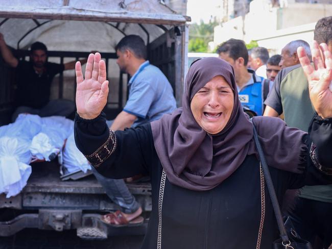 A Palestinian woman reacts as bodies of people killed in overnight Israeli shelling arrive for their funeral in Khan Yunis in the southern Gaza Strip. Picture: AFP