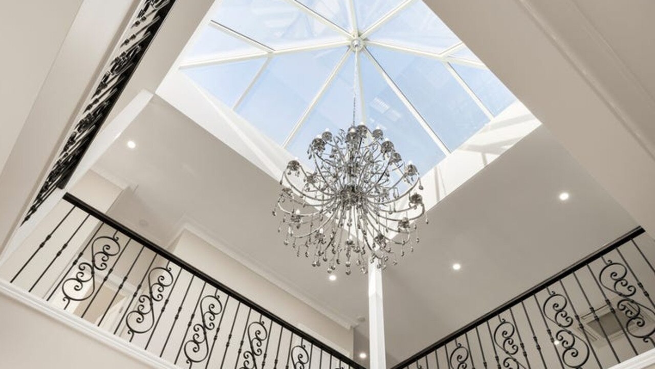 One of the light voids featuring a chandelier.