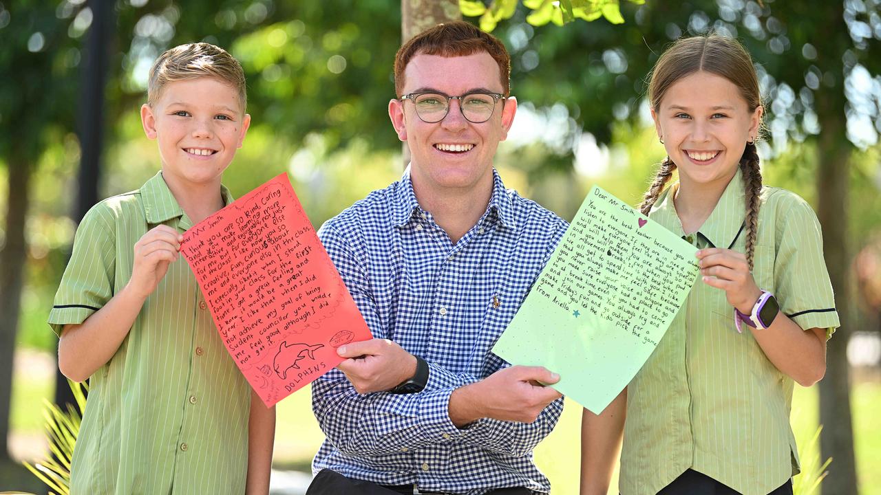 Mango Hill State School, yr 5 students, Duke Migala 10 and Ariella Dalzell 10, with their favourite teacher Harry Smith who taught them in yr 4, holding the letters they wrote to him, Mango Hill, Brisbane. pic: Lyndon Mechielsen/Courier Mail