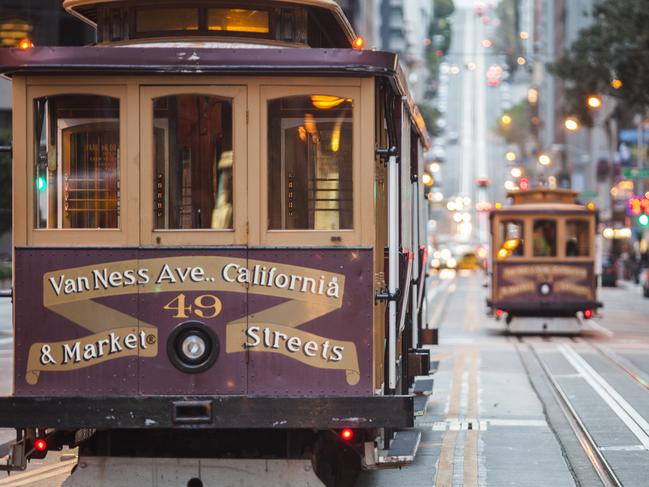 Cable cars on city street, San Francisco, California, USA