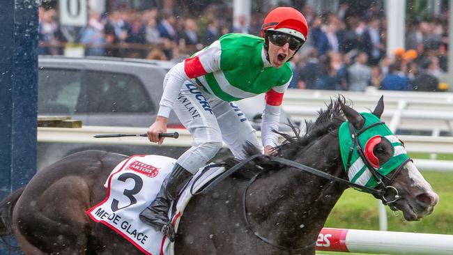 Damian Lane celebrates after winning the Caulfield Cup on Mer De Glace. Picture: Jay Town