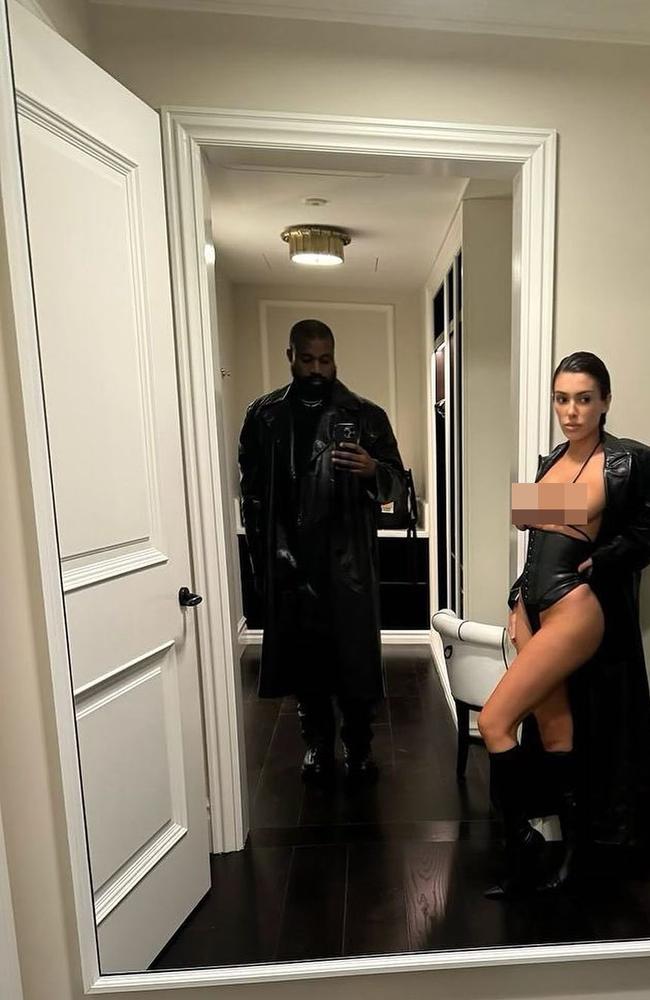 The Melbourne-born designer struck a racy pose in a selfie alongside West, pairing a micro top with a leather corsetted bottom, trench coat, and high-heeled boots. Picture: Instagram @jeen_yuhs_