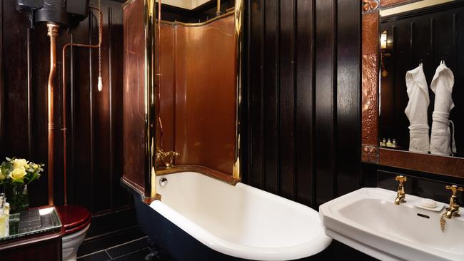 Bathroom of the Tudor Suite, with its copper-screened tub.